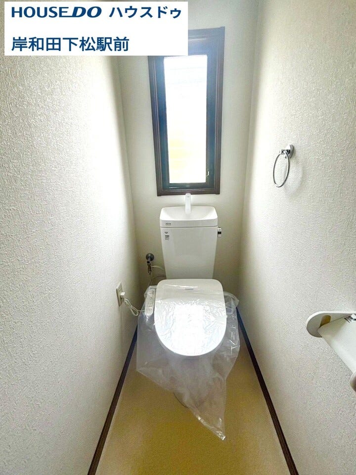 白を基調とした清潔感のある1階トイレ。