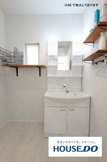 脱衣スペースもしっかり確保された清潔感のある洗面室。忙しい朝の身支度もスムーズに行える広さです。