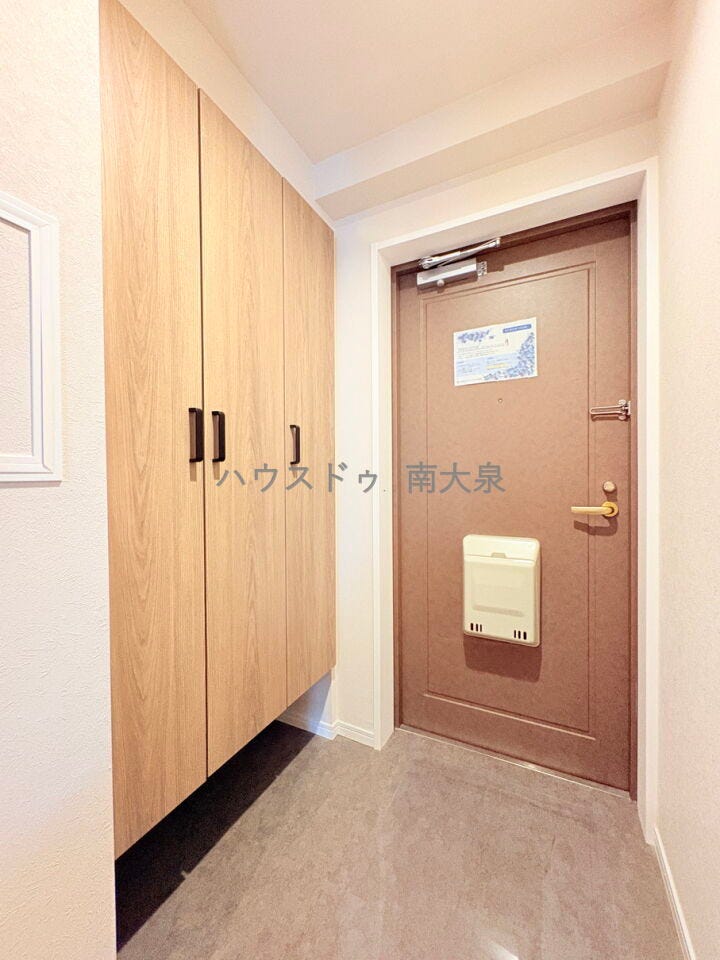 玄関は柔らかい雰囲気